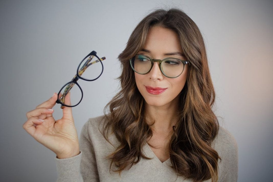 woman-choosing-eyeglasses woman-choosing-eyeglasses