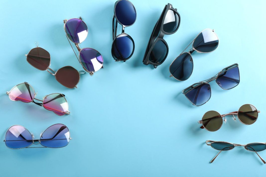 different-modern-sunglasses on-color-background