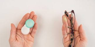 How to Make the Switch from Contacts to Glasses a-woman-makes-a-choice-between-lenses-and-glasses