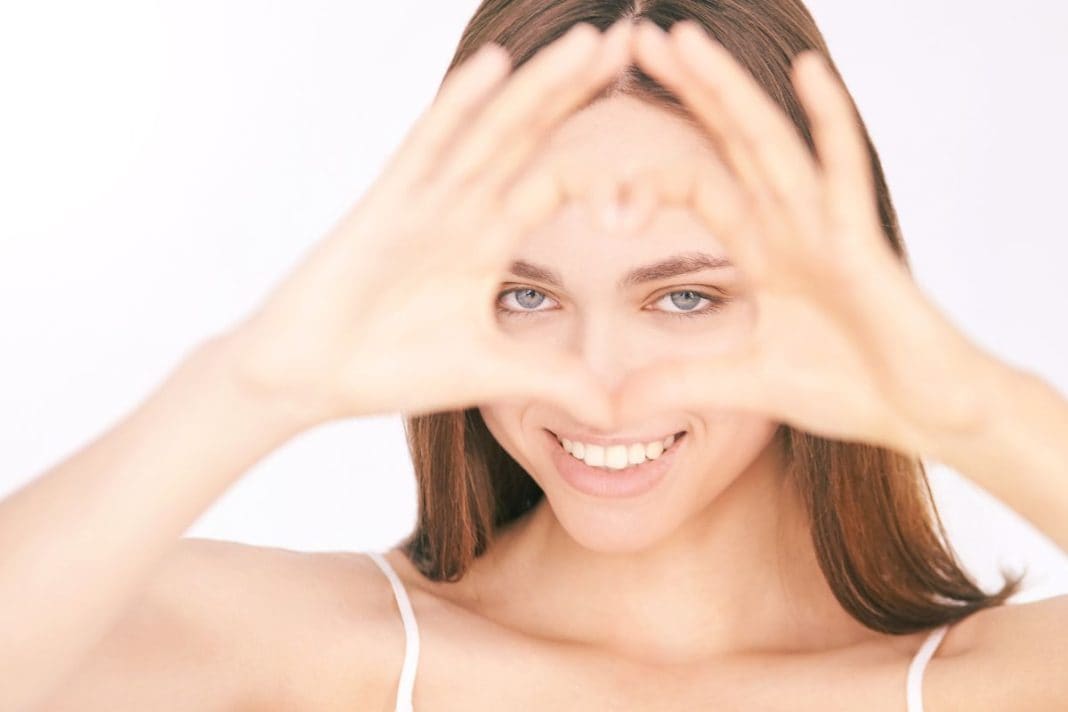 young-beautiful-woman-heart-gesture young-beautiful-woman-heart-gesture