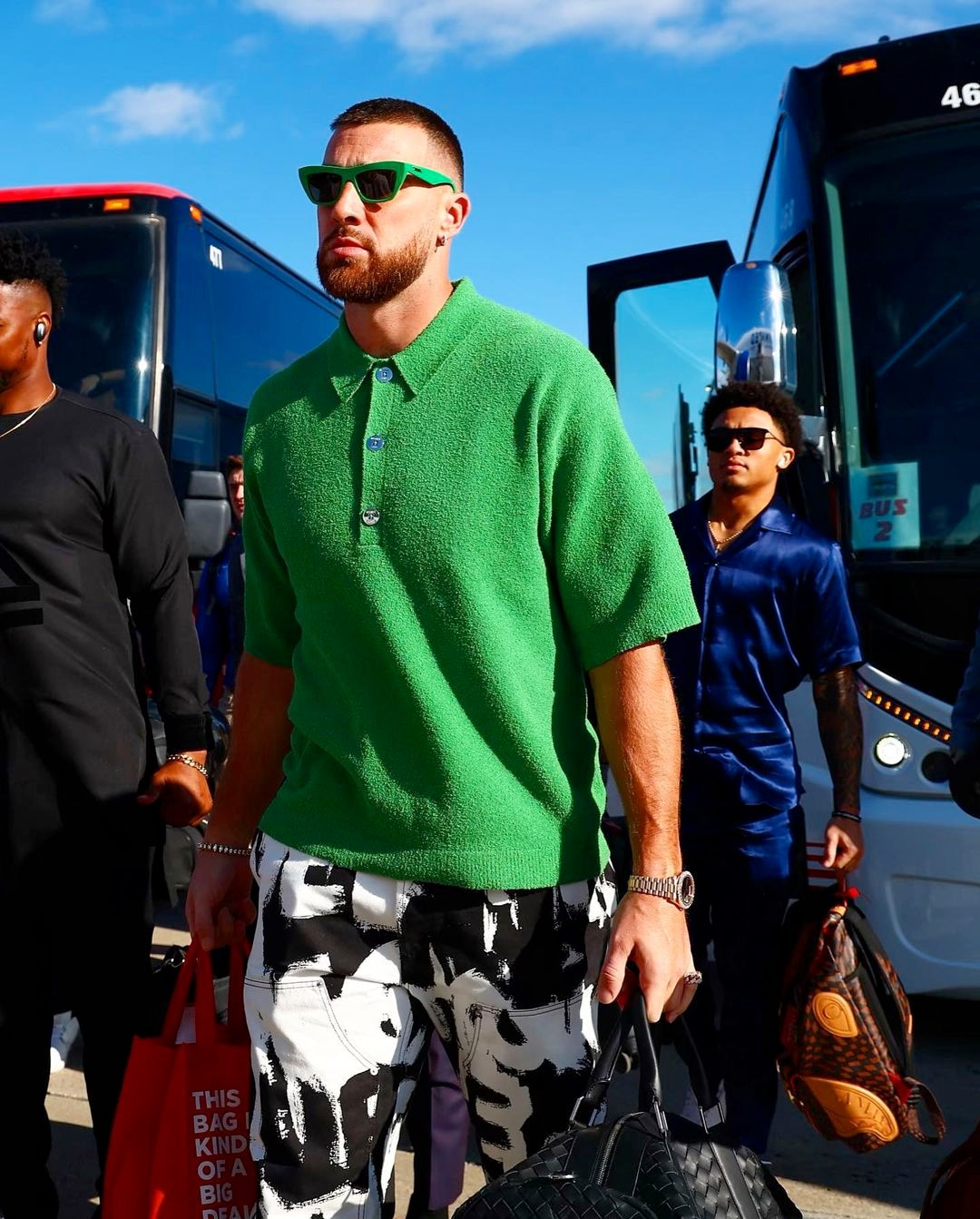 Travis Kelce wearing green sunglasses.