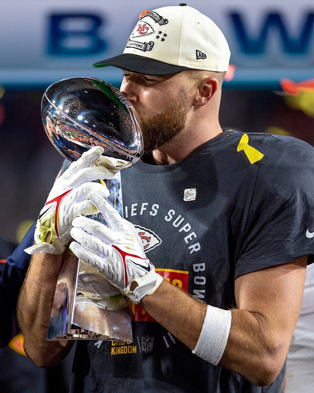 Travis Kelce bagging the championship trophy at the Super Bowl.