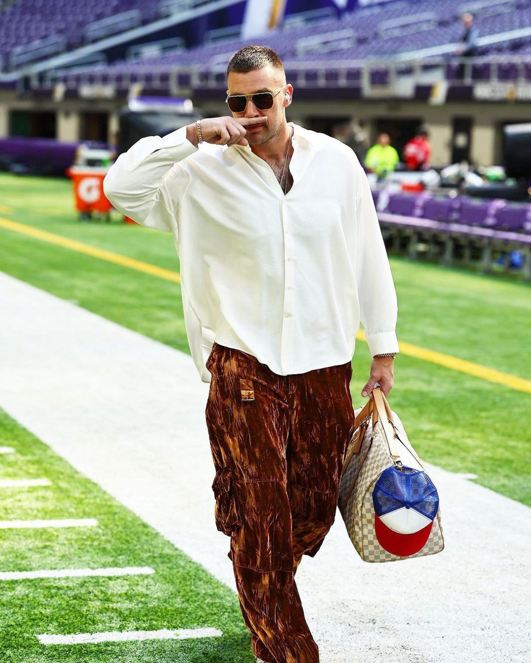 travis featured Travis Kelce wearing sunglasses and sporting his signature pose.