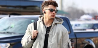 Glare and Glory: Patrick Mahomes’ Sunglasses, NFL Stardom, and Awards Patrick Mahomes wearing sunglasses and a gray hooded sweater.