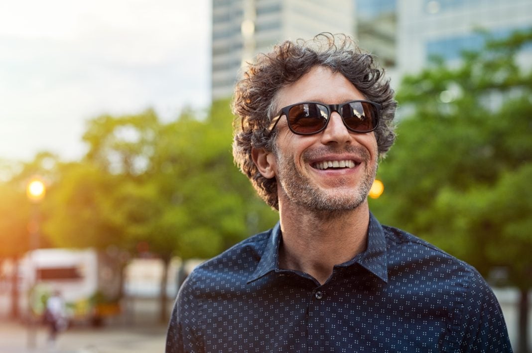 Happy man wearing sunglasses A man wearing the best sunglasses for Father's Day