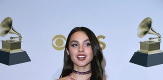 Get ‘Obsessed’ With Olivia Rodrigo’s Style: Sunglasses and Cool Outfits Olivia Rodrigo holding awards.