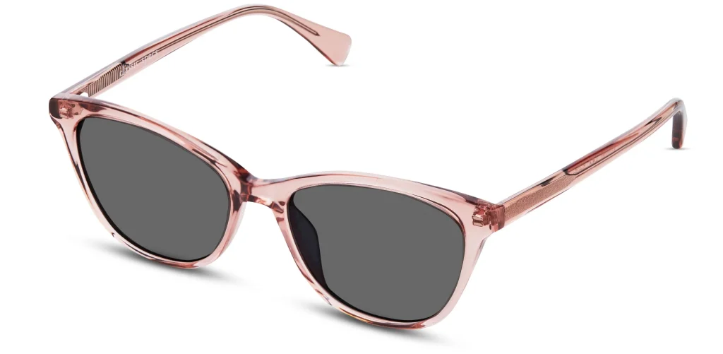 Edie sunglasses in Dusty Rose Crystal with a light blush acetate frame and dark lenses.