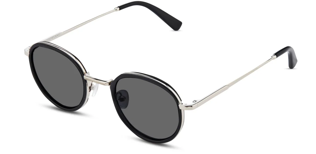 Fritz sunglasses in Black with Polished Silver with oval-leaning dark lenses, a black front, and slim silver metal arms.