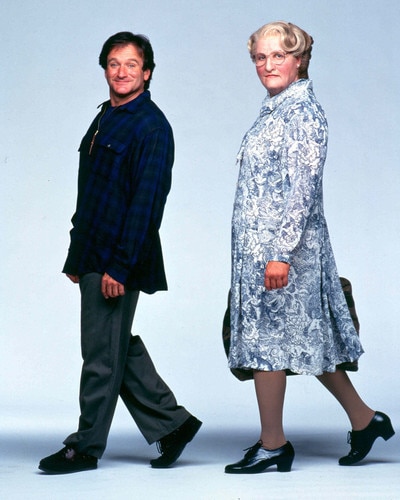 Side-by-side image from Mrs. Doubtfire showing Daniel Hillard as himself and disguised as Mrs. Doubtfire, wearing round glasses and a floral dress.
