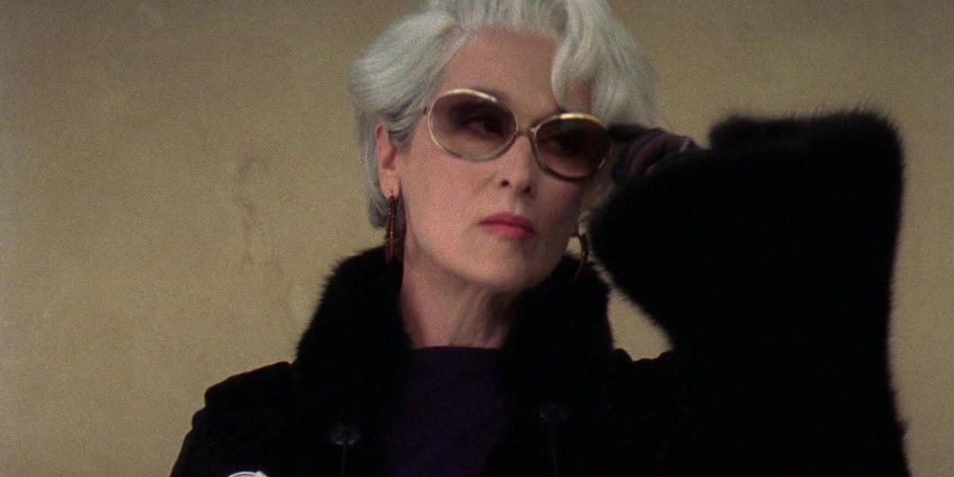 Miranda Priestly wearing oversized tinted sunglasses and a black fur coat in The Devil Wears Prada.